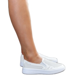Beige genombrutna slip-on sneakers från Dafina