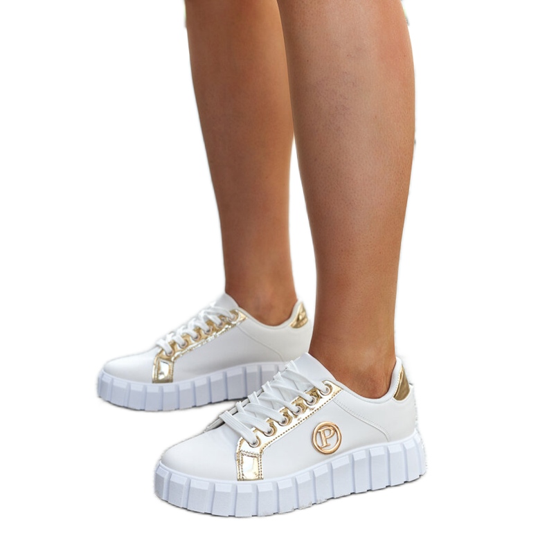 Vita och guld sneakers med en massiv Bionda-sula