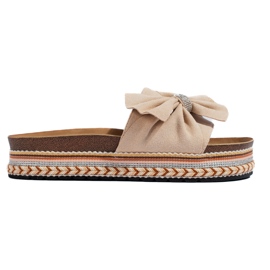 Beige mocka glider med rosett