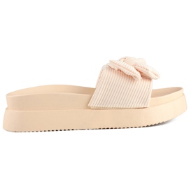 Beige damtofflor med rosett på en tjock sula