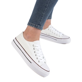 Kvinnors vita sneakers på plattformen