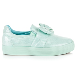 Slipons På Plattformen Med En Pilbåge grön