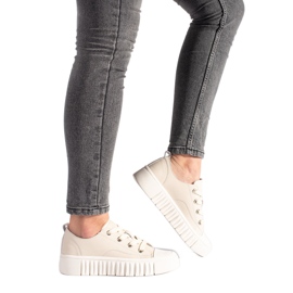 Sneakers i beige läder för kvinnor