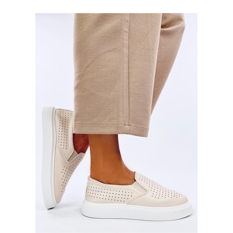Beige genombrutna slip-on sneakers