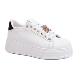 Sportskor med en vit stift