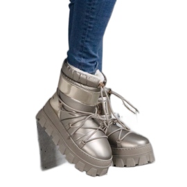 Guld plattform snöstövlar med patentinlägg gyllene