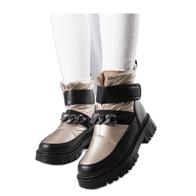 Guld snöstövlar med kedja Ephraim - Solea