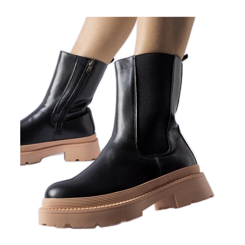 Svarta ankelboots med ljusrosa sula