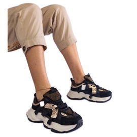 Svarta sneakers med guldinlägg