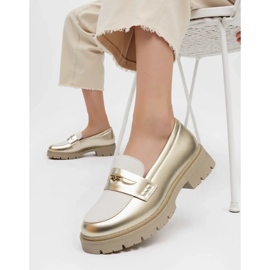 Kvinnors guldbrister gyllene