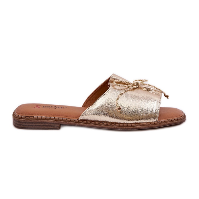 Flat sula flip flops med en dekorativ guldbåge gyllene