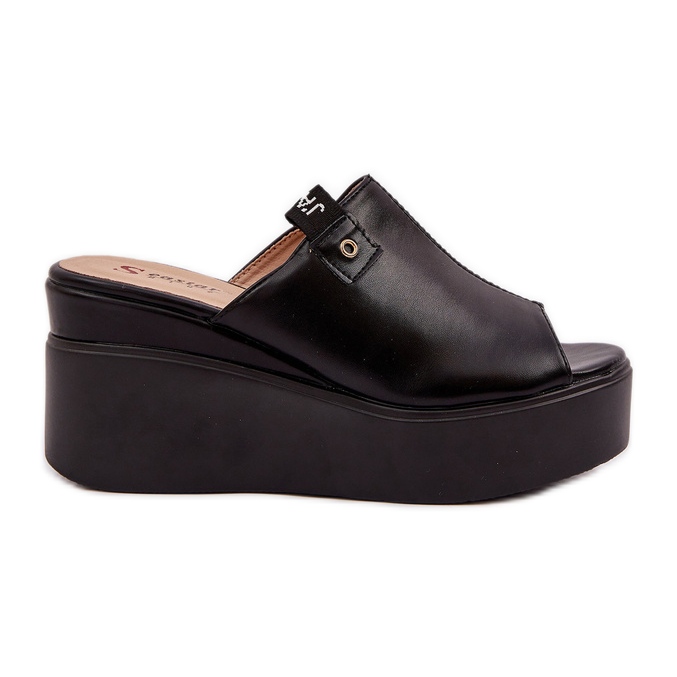 Tofflor på plattformen och en kil Eco svart läder