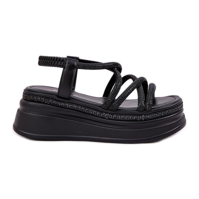 Sandaler på en massiv plattform med svarta ränder