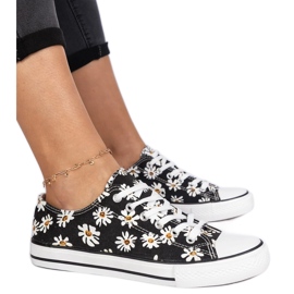 Svarta kvinnors tyg sneakers med blommor