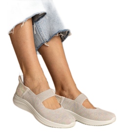 Färgglada kvinnors sneakers på en pressad sula mångfärgad