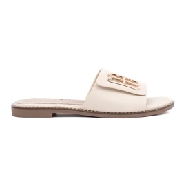 Goodin Ljus -för kvinnors flikar på en platt sula med en prydnad beige