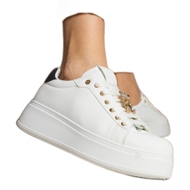 Kvinnors vita och vita sneakers dekorerade med stenar