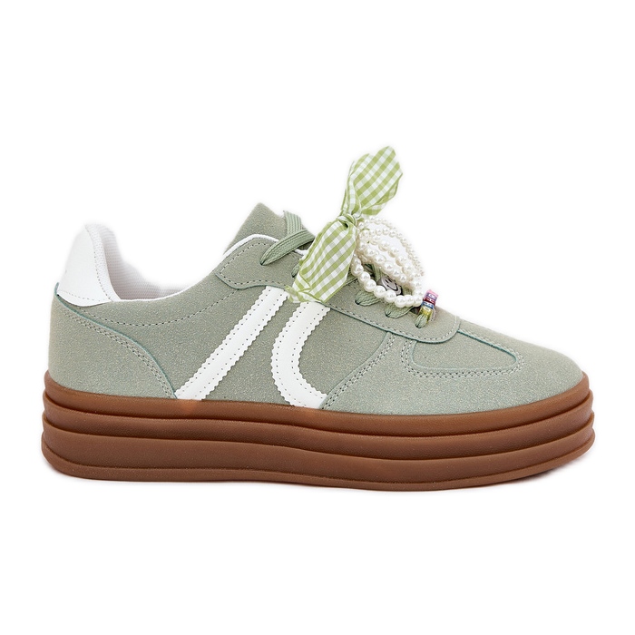 Kvinnors sneakers på plattformen med gröna ornament