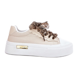 Kvinnors sneakers på en massiv plattform med dekorativ snörning beige