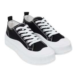 Svarta och vita sneakers med tjock sula