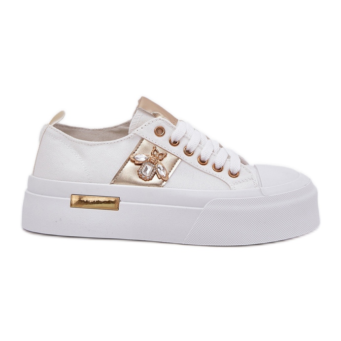 Kvinnors sneakers på plattformen med en dekorativ detalj vit