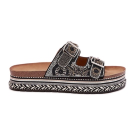 Talltor med dekoration och spännen på den svarta plattformen