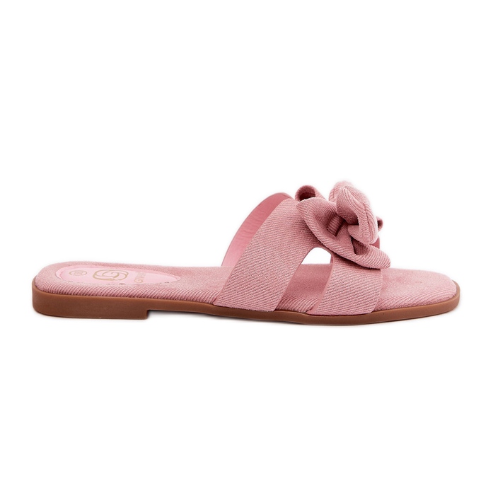 Platta kvinnors flip flops med en rosa båge