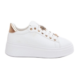 Kvinnors sneakers på plattformen med vita stift