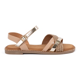 Gyllene kvinnasandaler på en platt sula Sergio Leone