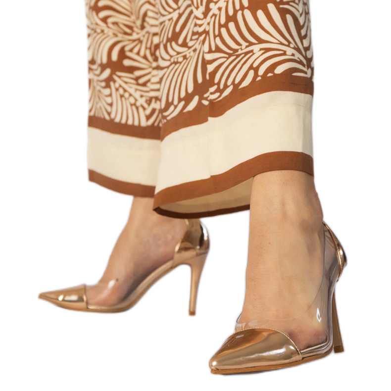 Klassiska champagnepumpar med en transparent övre gyllene