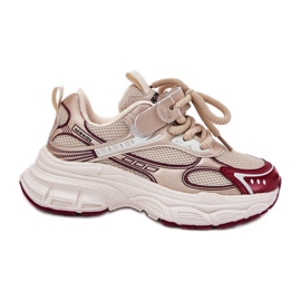 Barns sneakers på en tjock guldsula gyllene