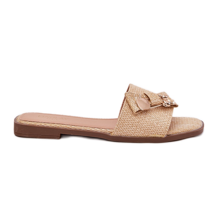 Inna Flat -hanterade kvinnors flip flops med en båge -beige