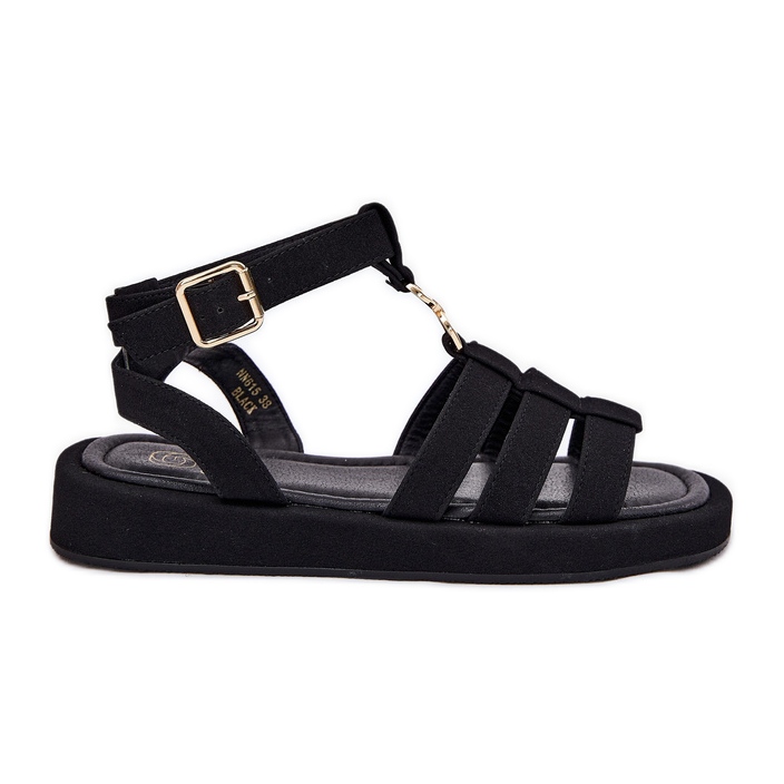 Kvinnors sandaler på plattformen med en gyllene detalj svart