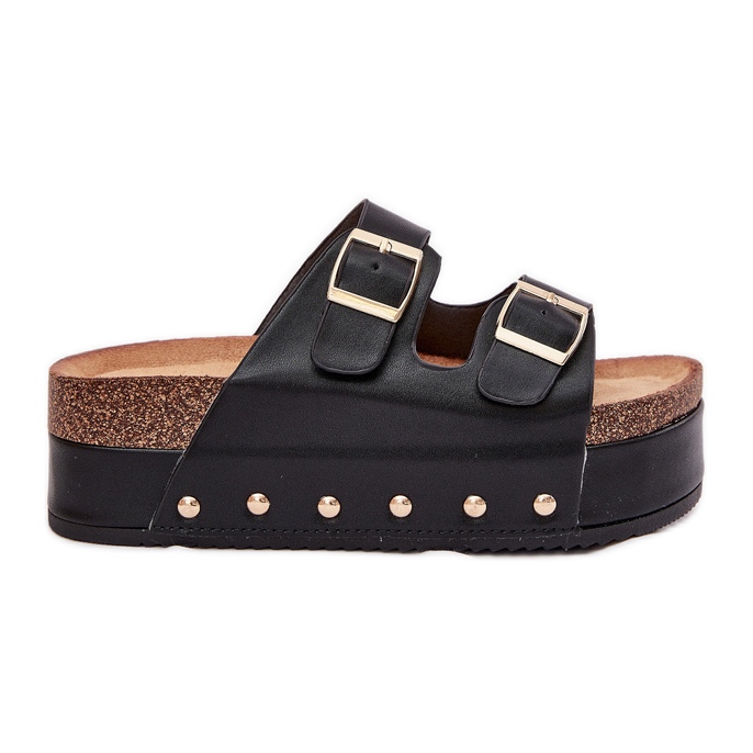 Kvinnors flip flops med spännen på en massiv plattform svart