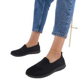 Svarta kvinnors sneakers