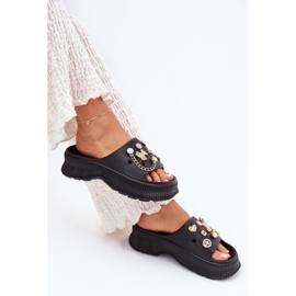 Kvinnors skum flip flops med gyllene stift svarta stift