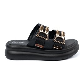 Seastar Tofflor med gyllene spännen på plattformen svart