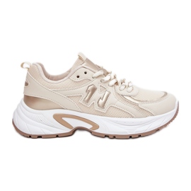 Kvinnors sneakers på en massiv beigesula