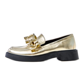 Gyllene loafers med en båge och teriwa nallebjörn