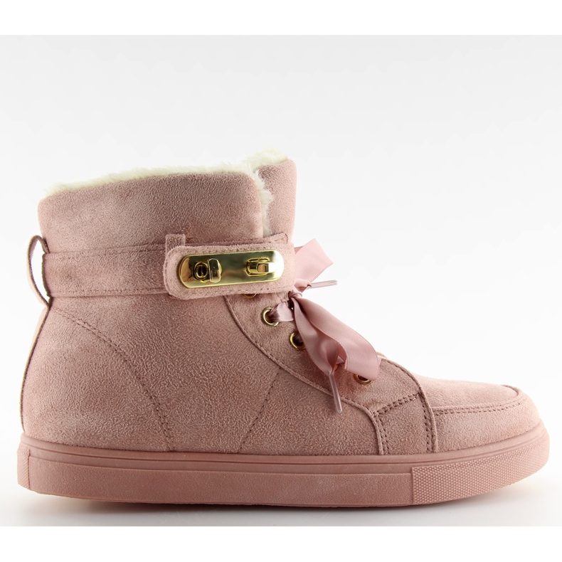 Isolerade kvinnors sneakers rosa rosa