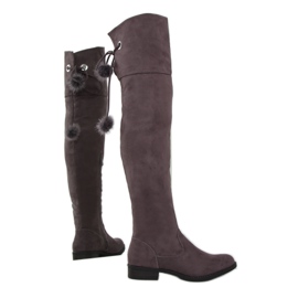 Mockamusketörstövlar med pompoms mångfärgad brun