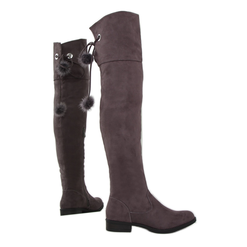 Mockamusketörstövlar med pompoms mångfärgad brun