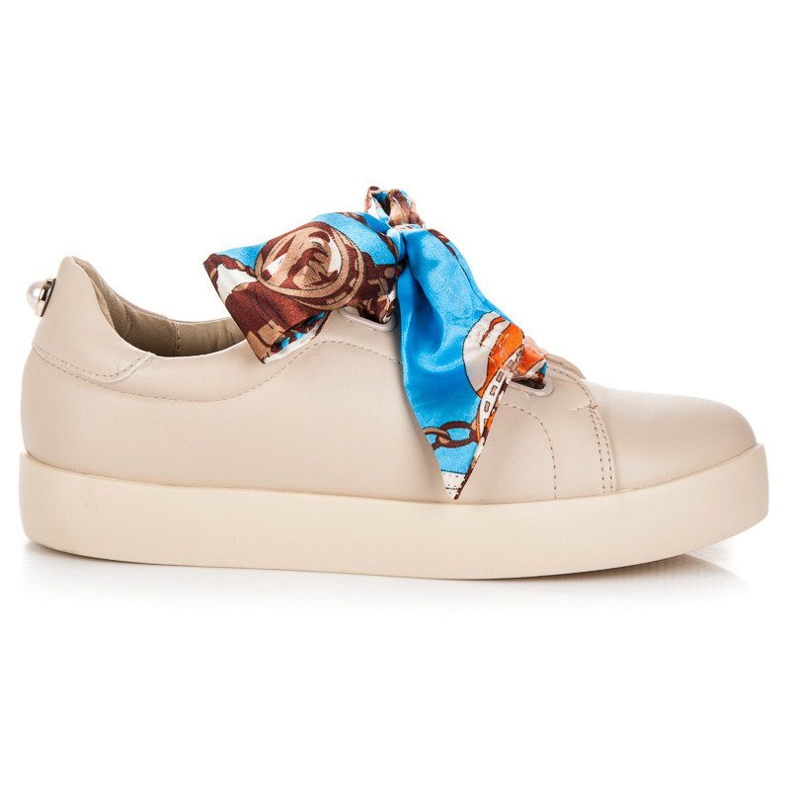 Sneakers bundna med ett VICES-band beige