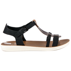 Sandaler Fästs Med Ett Spänne svart brun