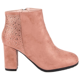 Mocka stövlar på stolpen rosa