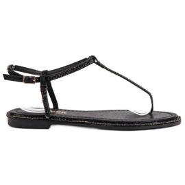 Comer Svarta sandaler av flip-flops