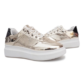 Adele's Gold Lacquered Openwork Sneakers gyllene
