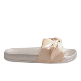 Gyllene tofflor med rosett 5835