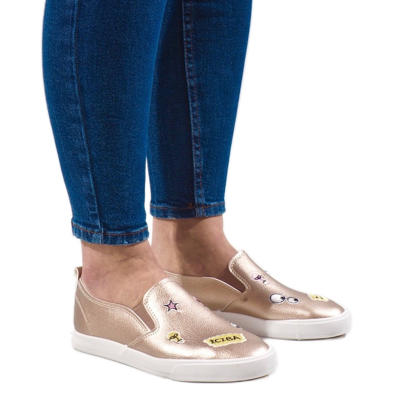 Gyllene sneakers med G82-5-tryck