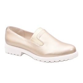 Guld-slip-on skor på XC683-3-plattformen gyllene